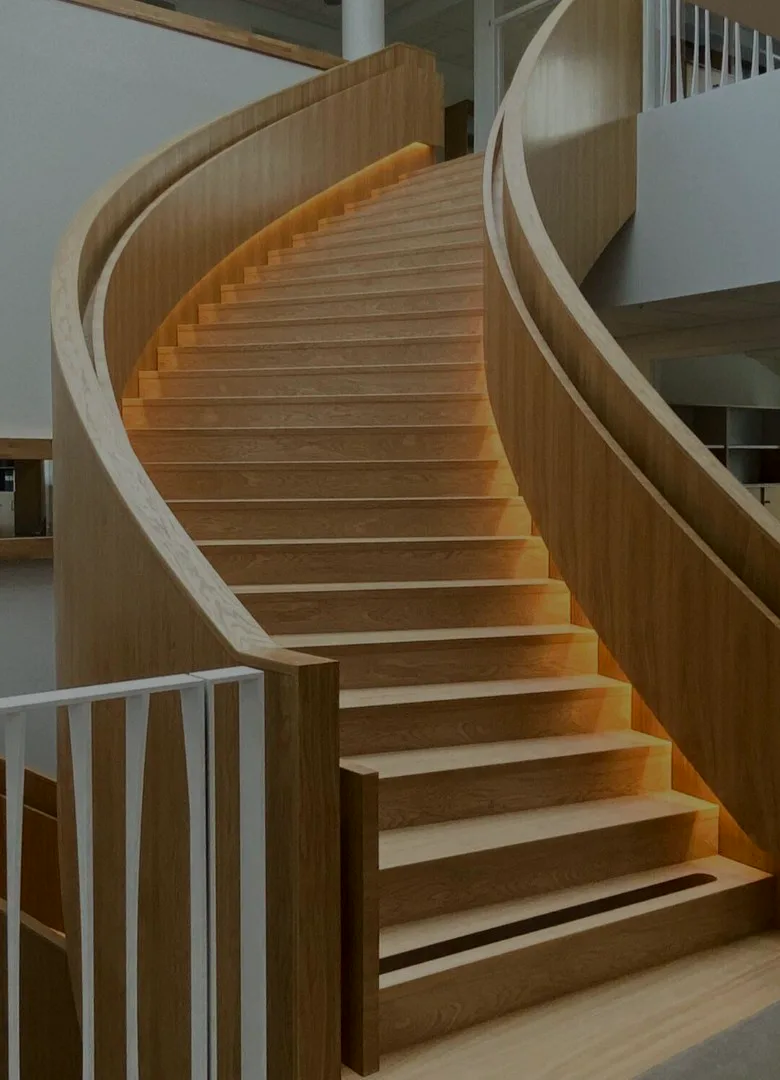 A curved timber staircase showing careful interior detailing